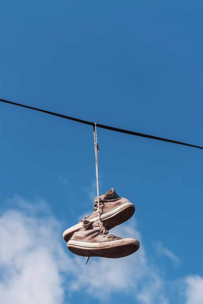 Why Tennis Shoes Are Dangling from Power Lines and What It Could Mean